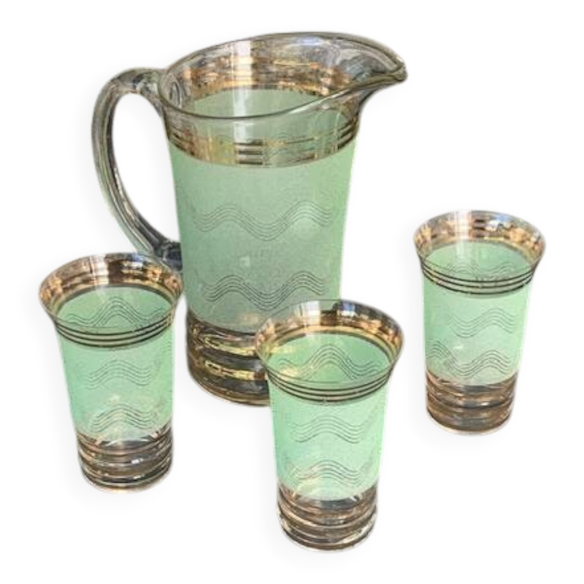Serve an orangeade, a carafe and 3 glasses in green granite with golden trim.