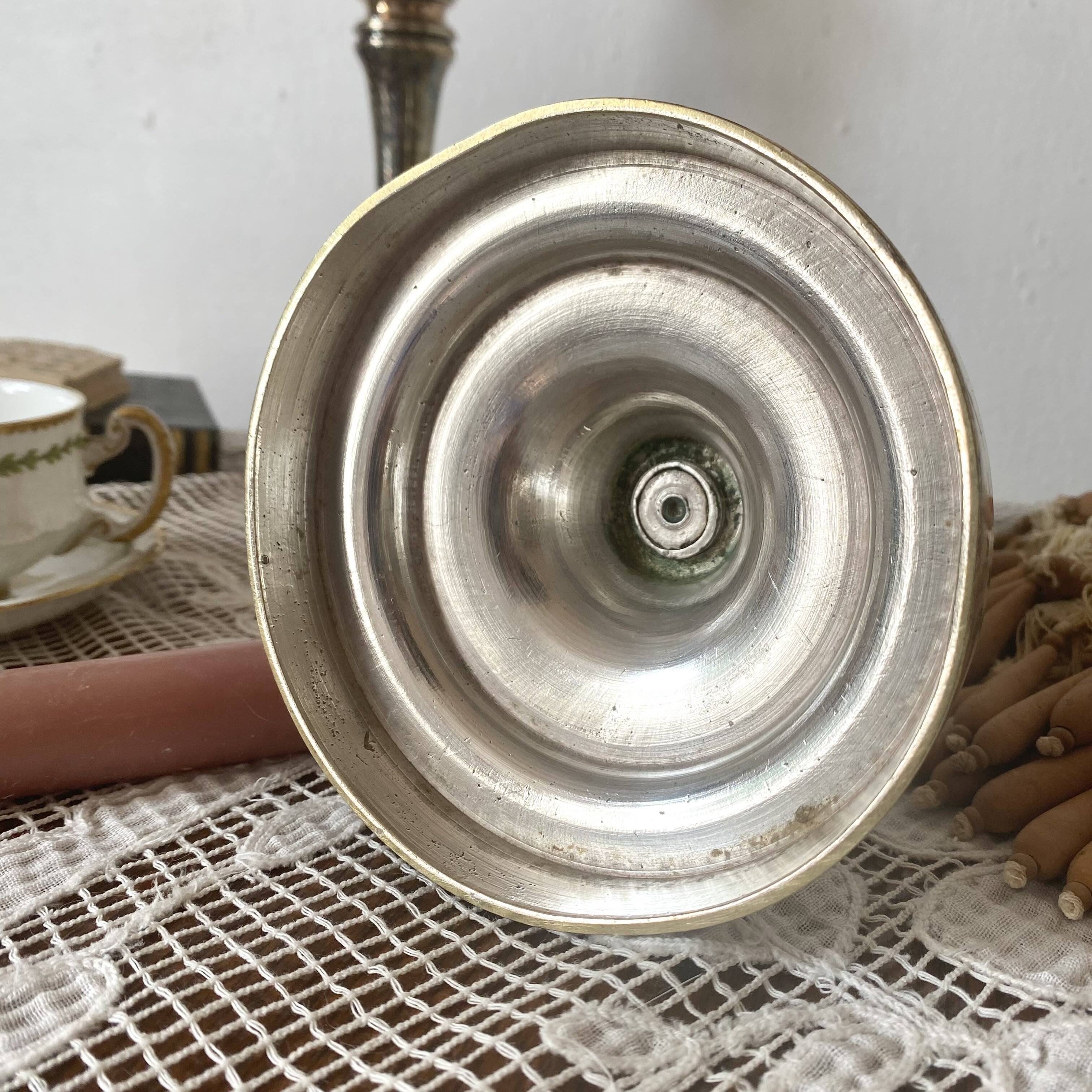 Pair of silver-plated metal candlesticks