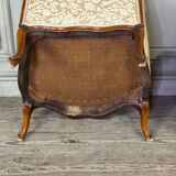 Pair of small Louis XV style wing chairs in carved walnut, Bosson stamp