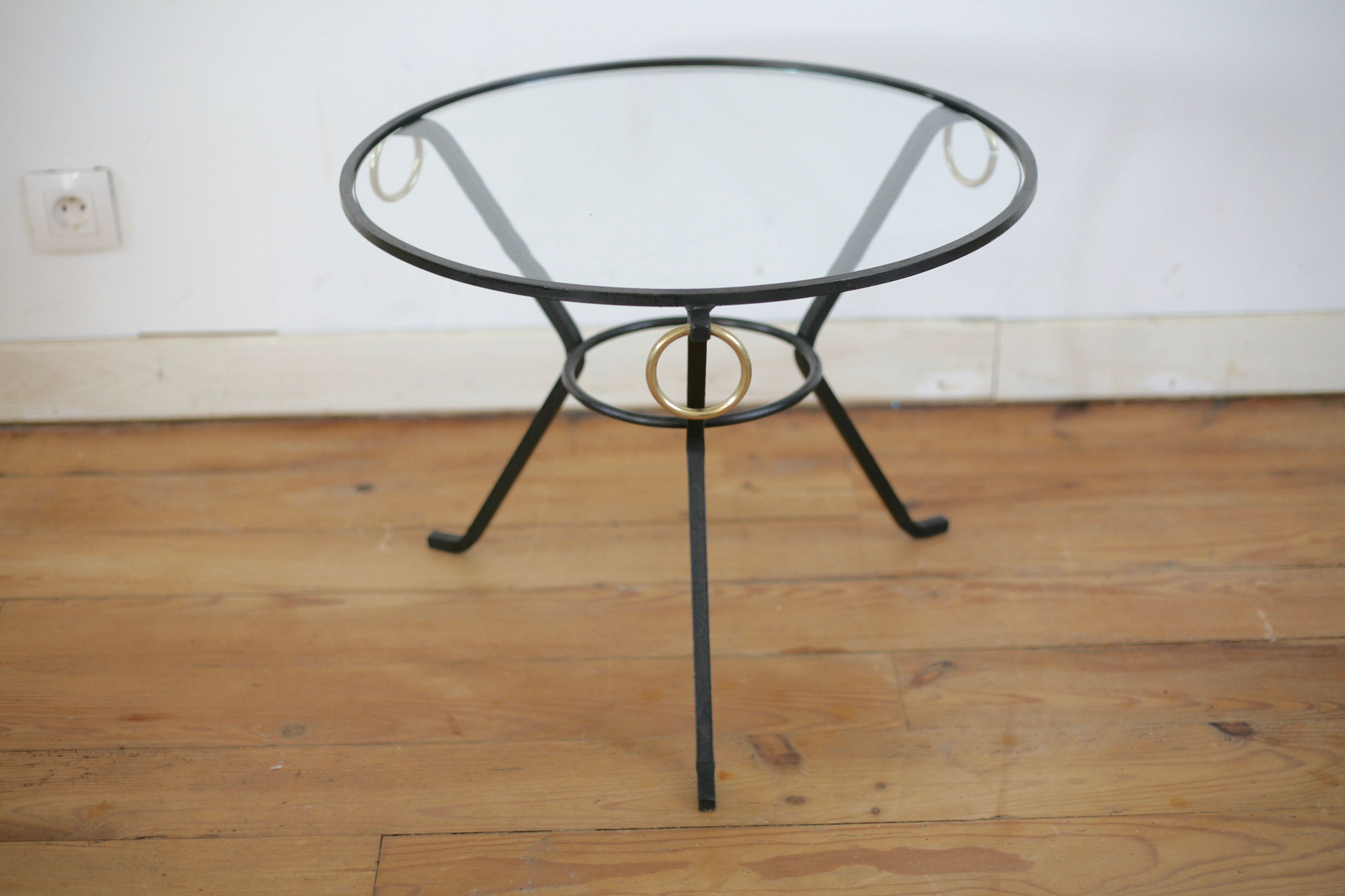 Coffee table black lacquered metal, glass and brass, France, circa 1950.