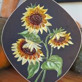 Decorative wall plate with sunflowers.