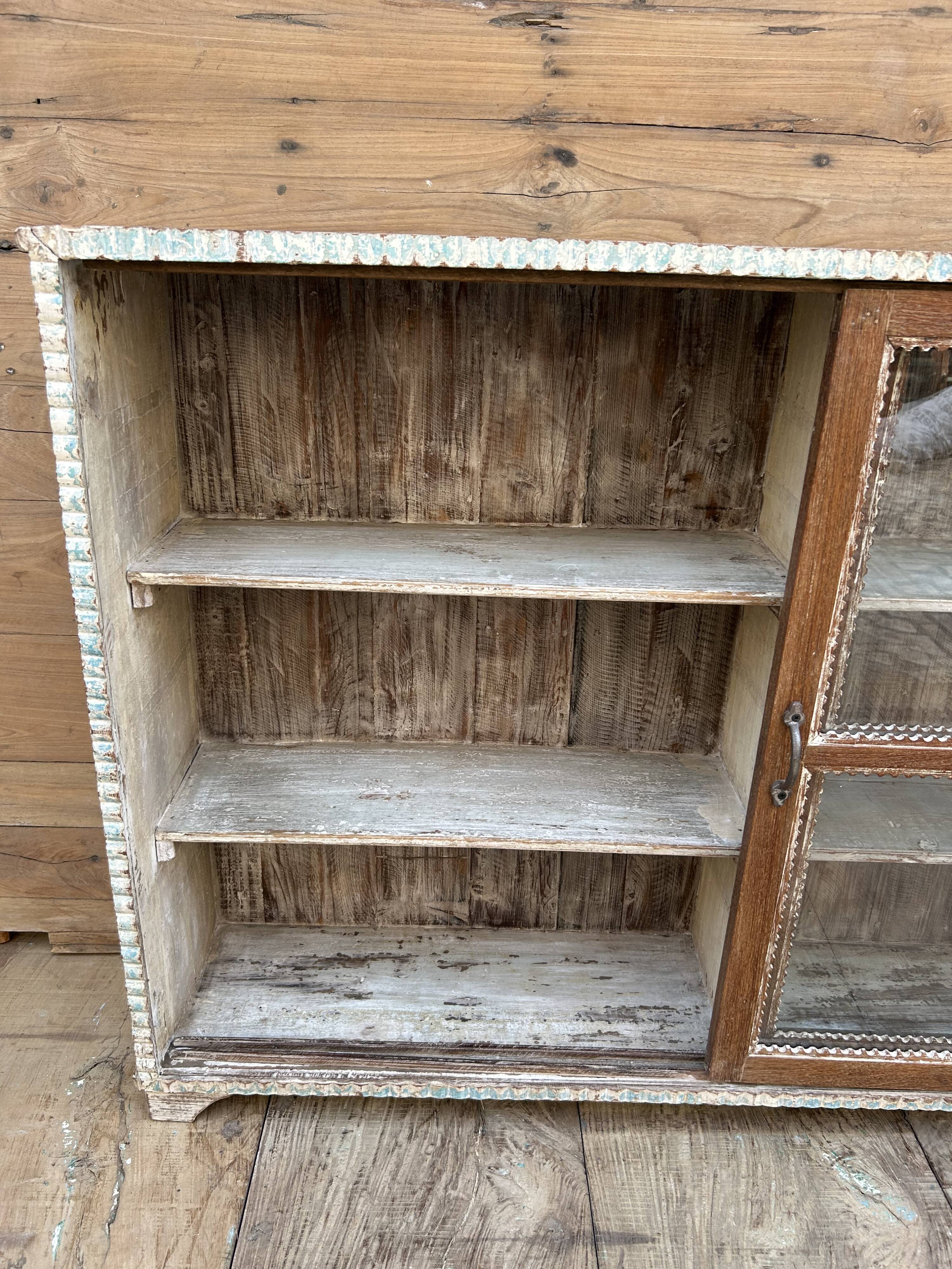 Teak display cabinet with sliding doors