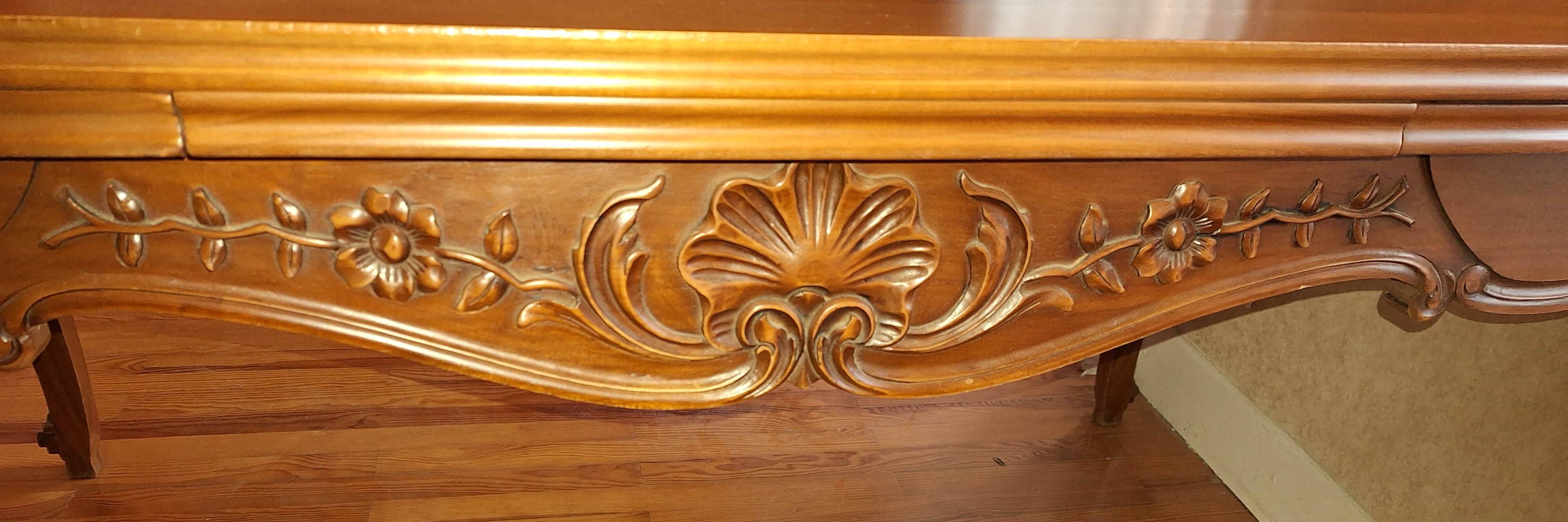 Extendable table in Louis XV style made of solid cherry wood and marquetry.