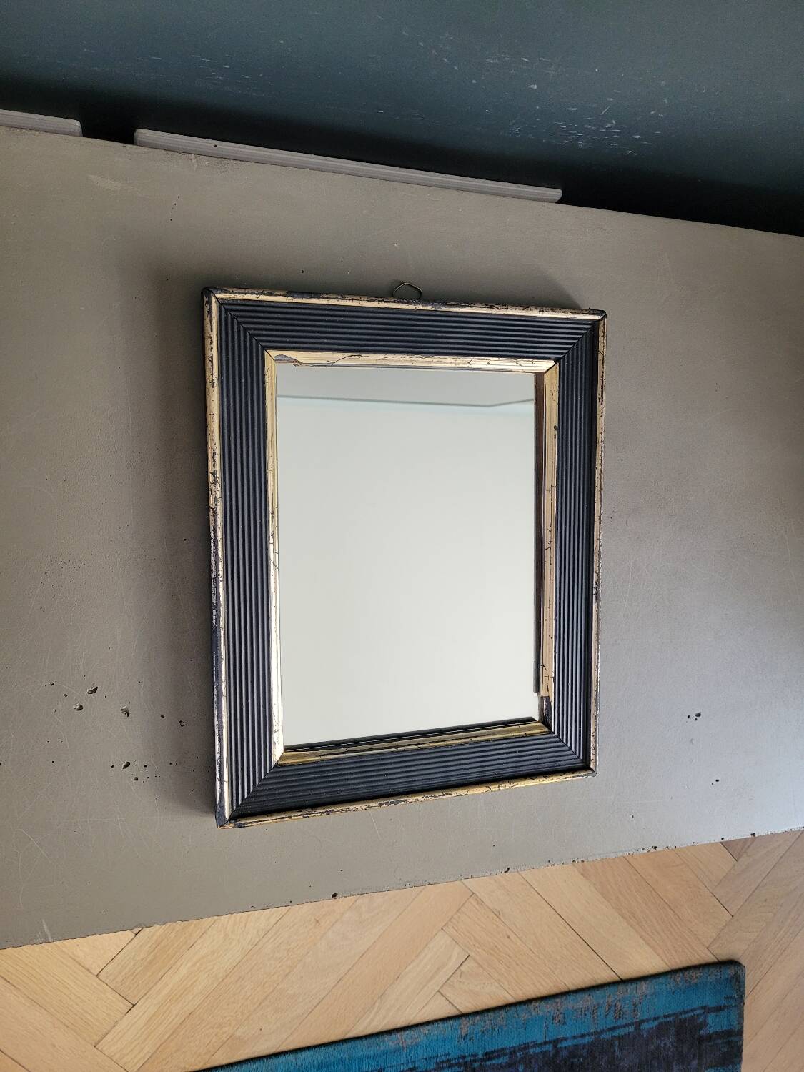 Antique black and gold wooden mirror