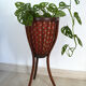 Travailleuse porte plante en rotin