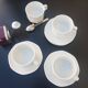 4 White cups and saucers