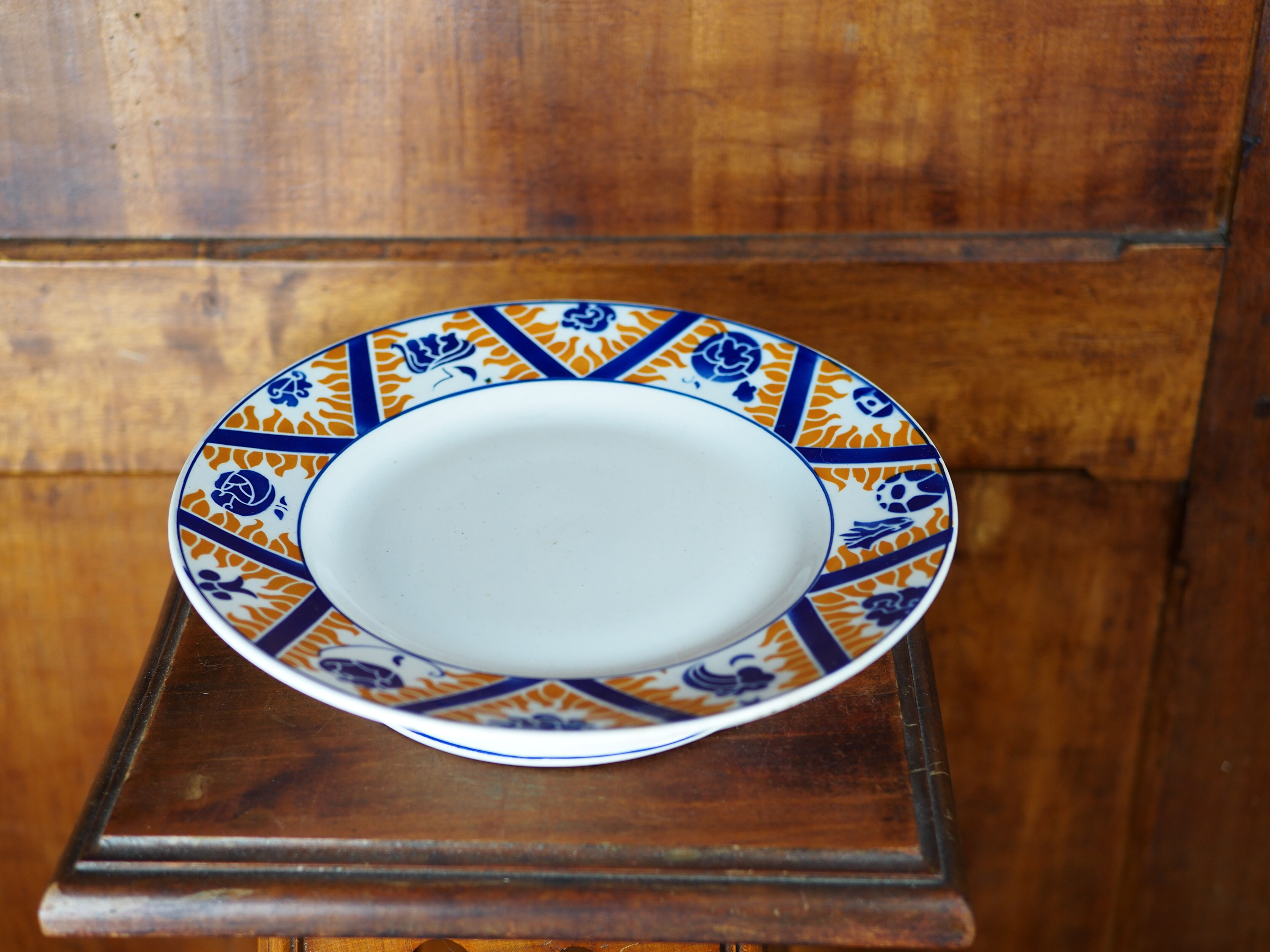 Earthenware cake dish patterned with flowers, clouds and flames, orange and blue - Orchies - 50s