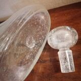 Clear bubble glass bottle molded for easy manual gripping