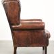 Vintage sheepskin wingback armchair in a deep brown colour finished