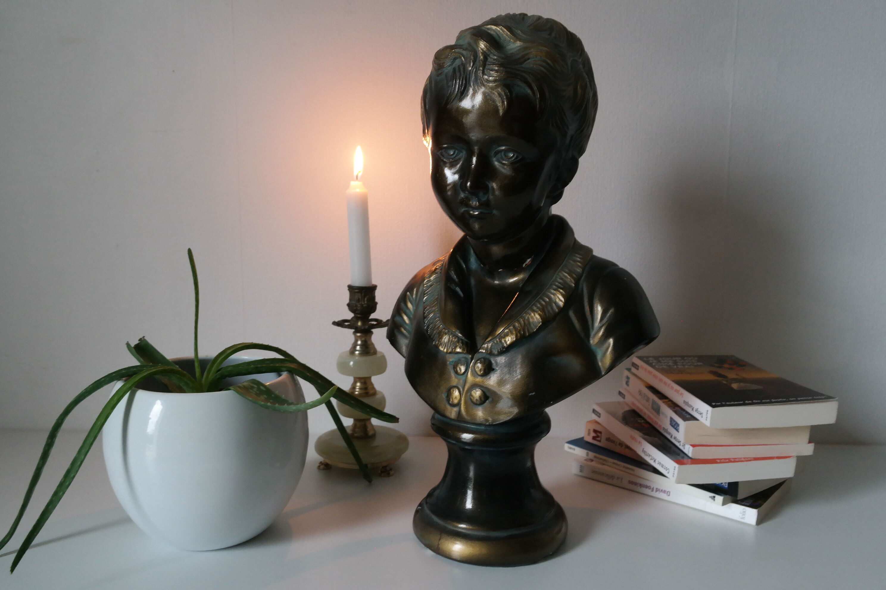 Buste en plâtre garçon patine bronze XXème