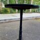 Round bistro table in cast iron and Bakelite, Louis Vuitton style, 1930s.