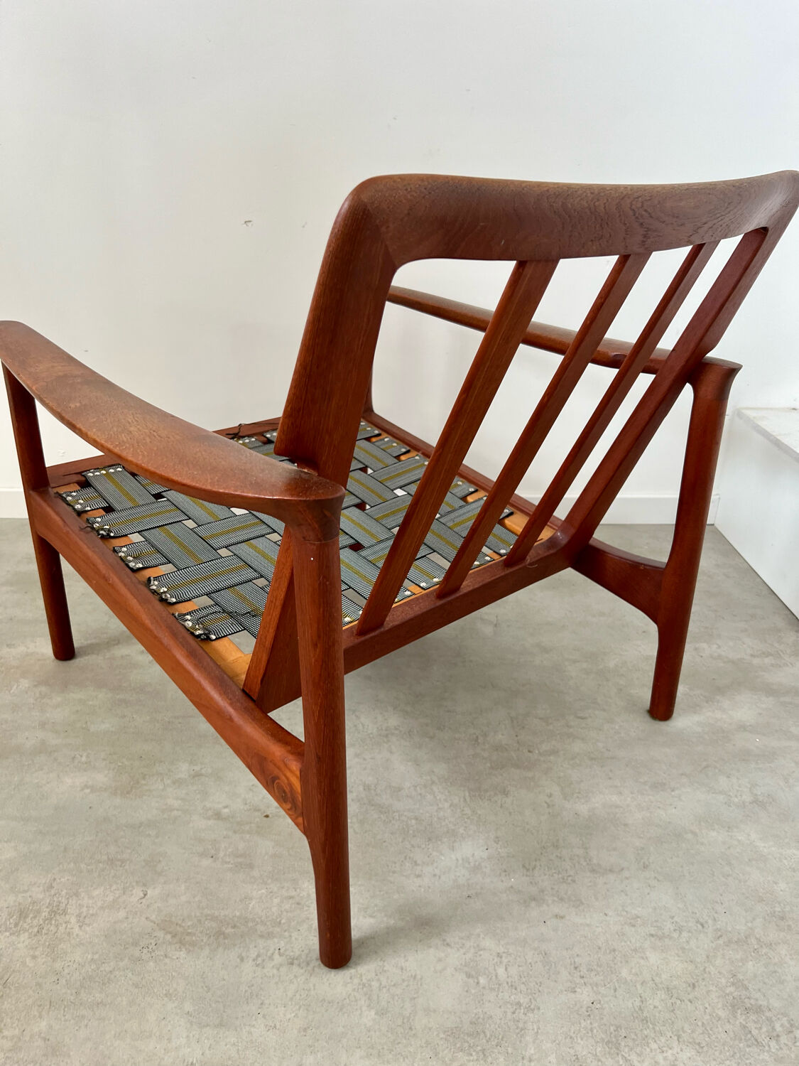 Old Scandinavian design armchair in vintage teak year 60
