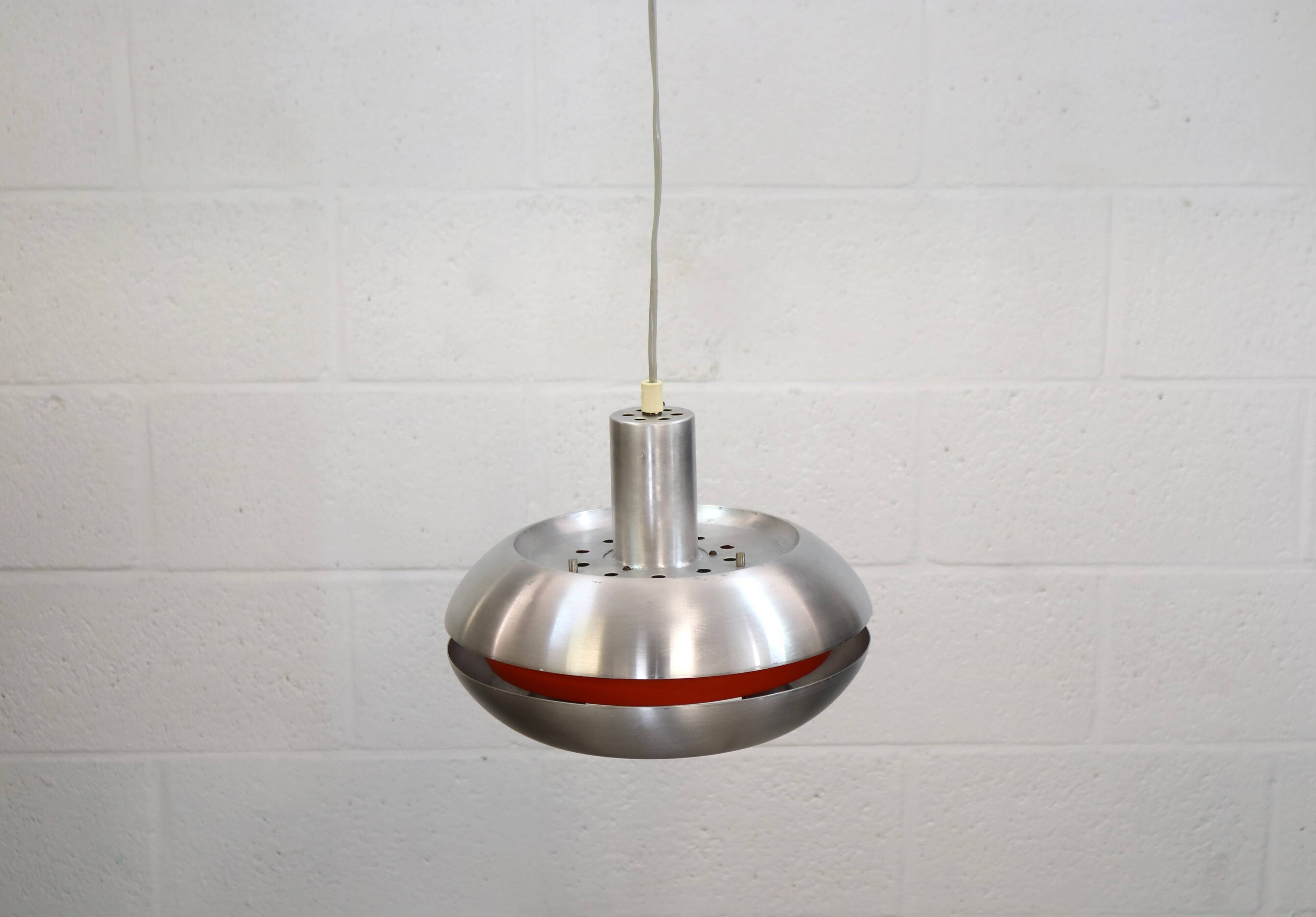 Old Danish space age design lamp in alu and orange inside.