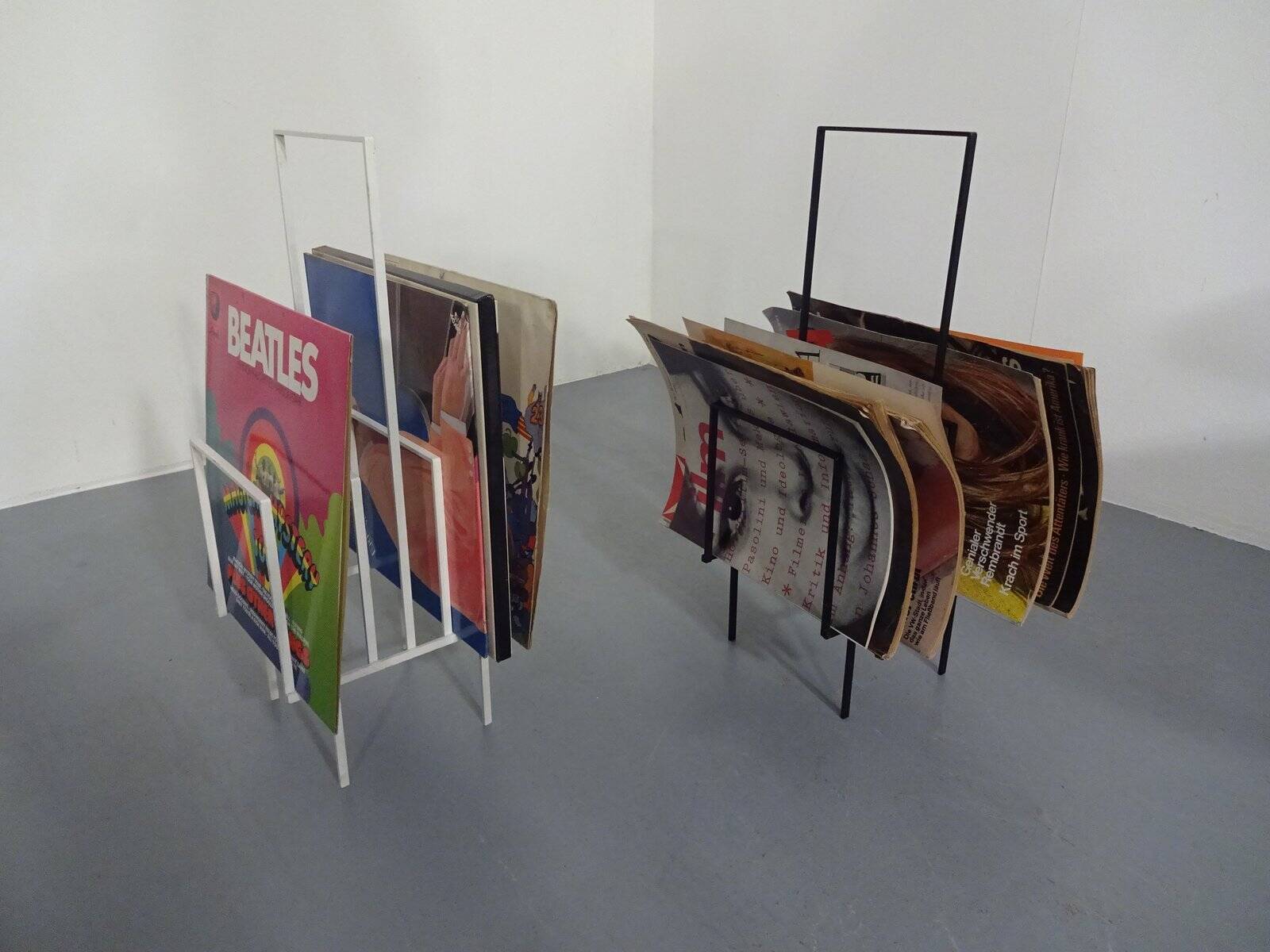 Steel magazine or record racks, 1960s, set of 2