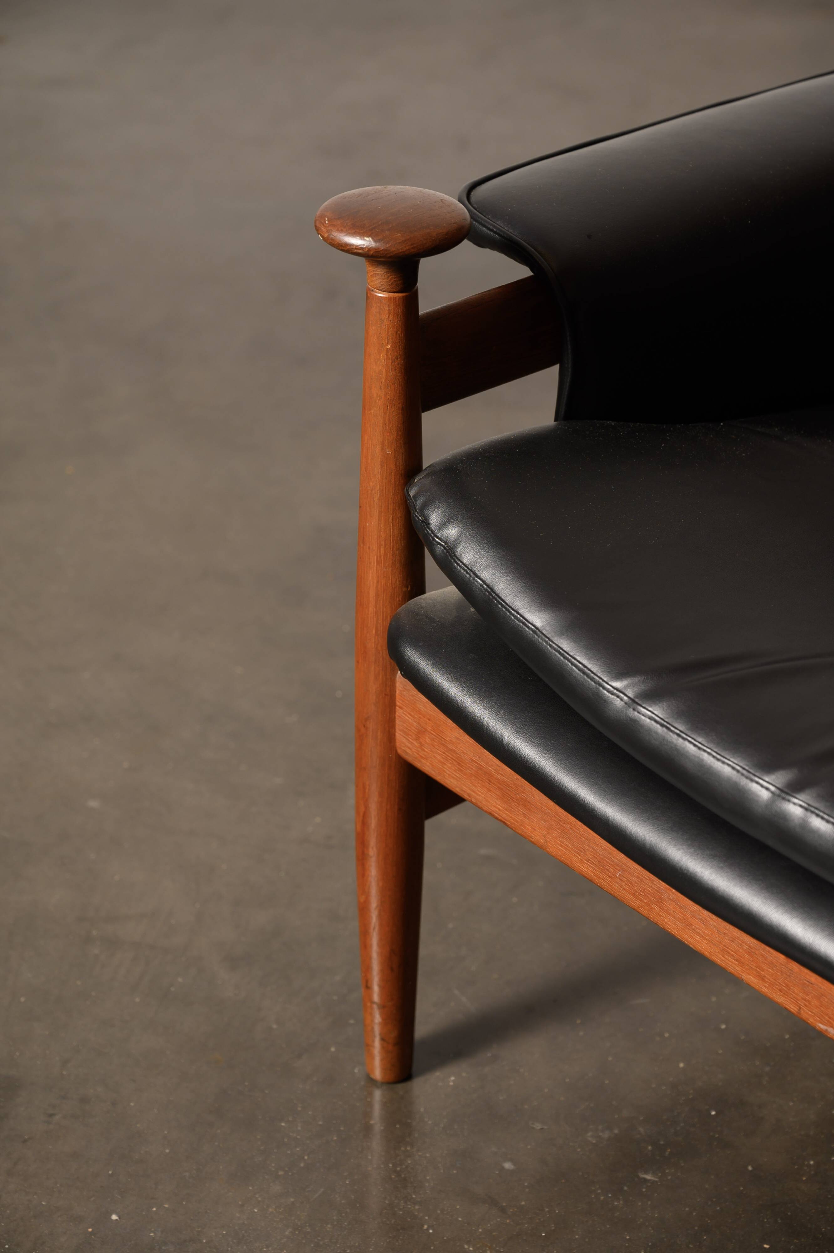 Finished Juhl armchair and its ottoman.