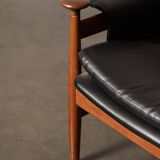 Finished Juhl armchair and its ottoman.