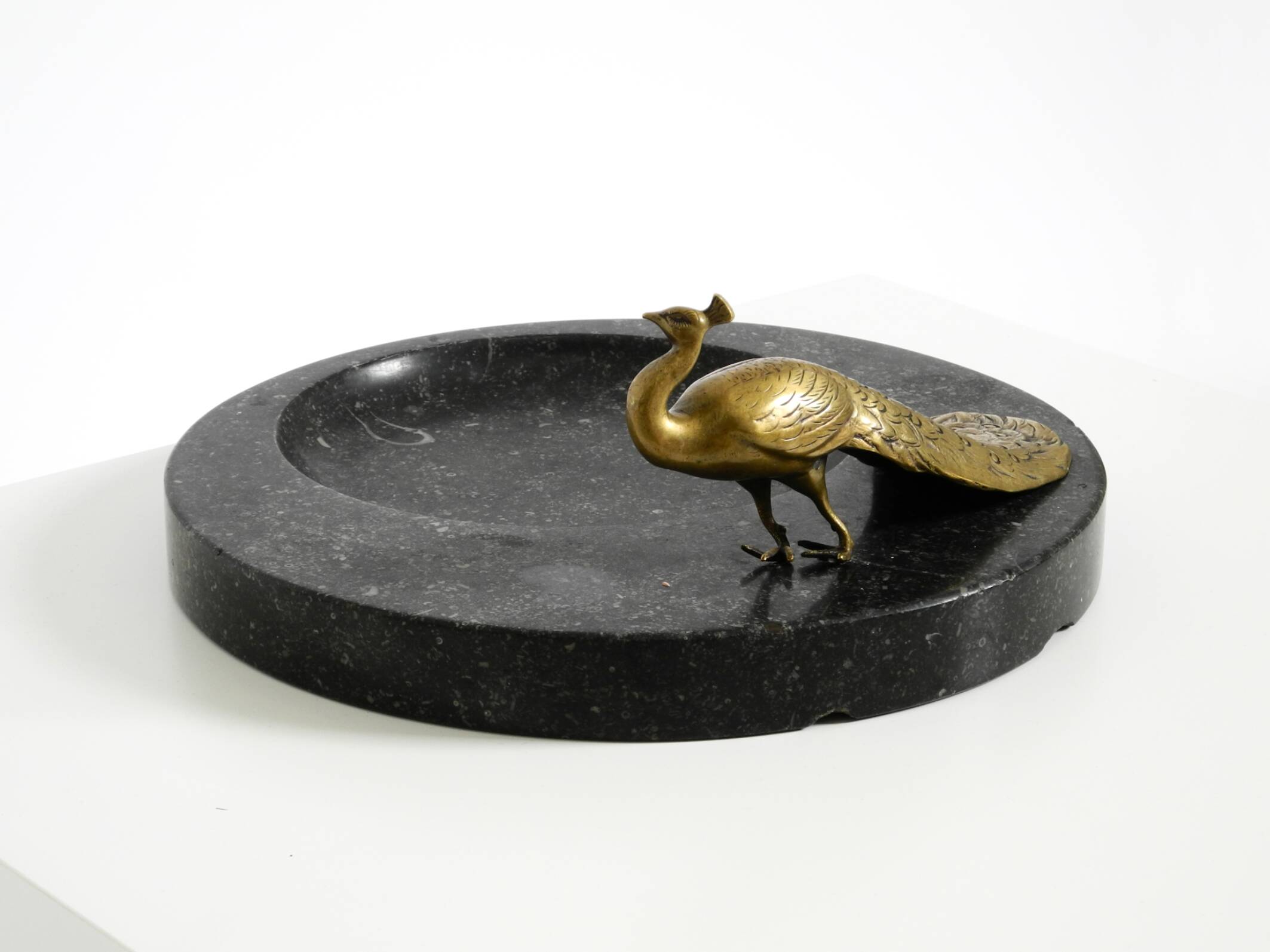 Beautiful, large black granite valet tray featuring a brass peacock, circa