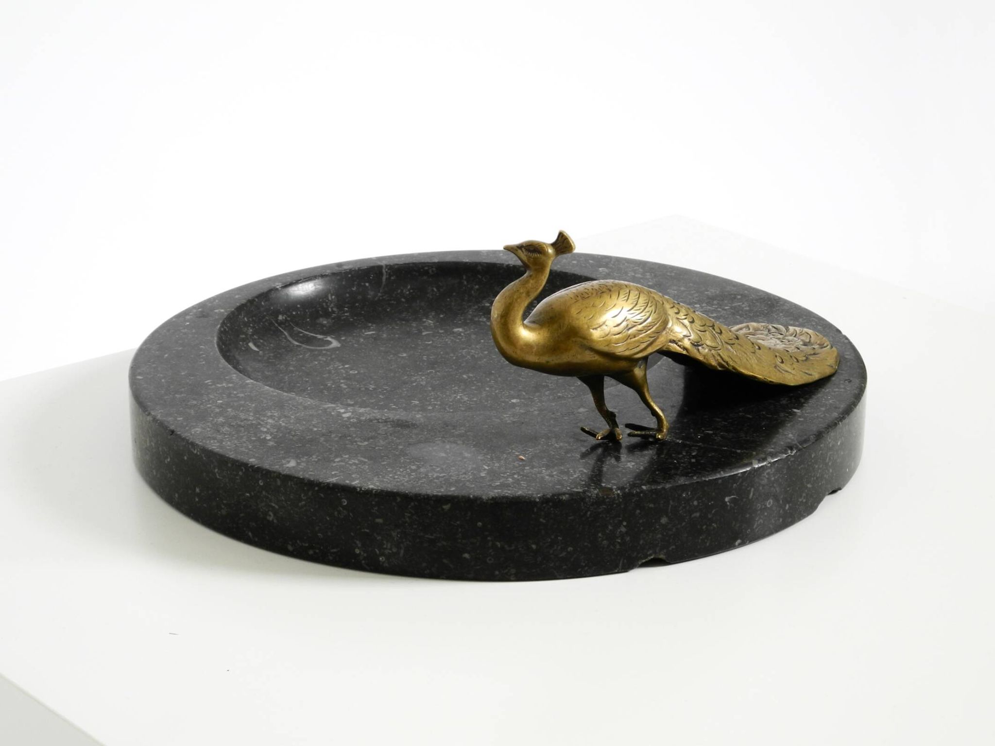 Beautiful, large black granite valet tray featuring a brass peacock, circa