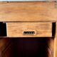 Counter, glass-fronted wooden workbench in dark wood, 8 drawers.