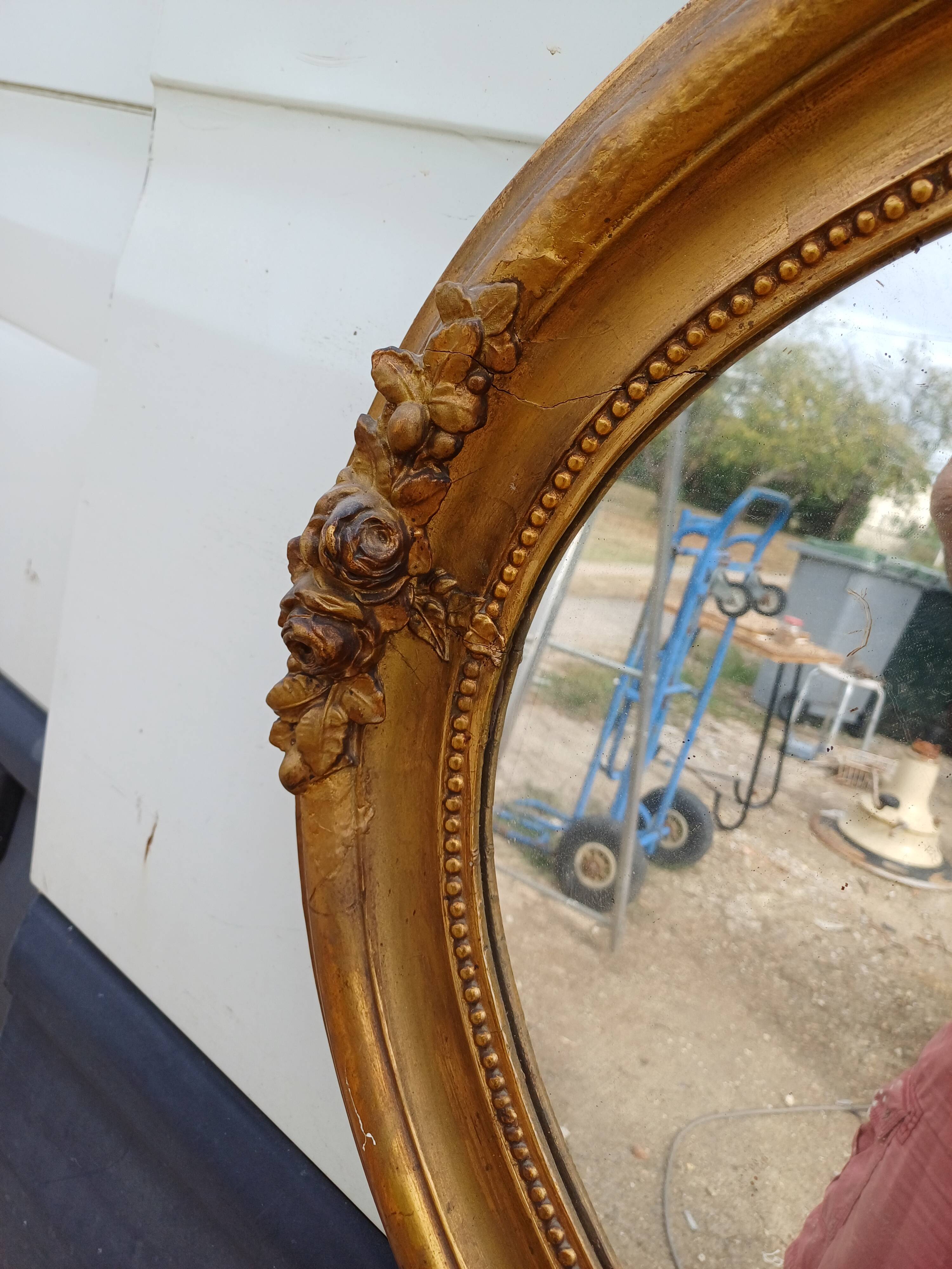 Oval mirror wood and gilded stucco 19th century