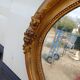 Oval mirror wood and gilded stucco 19th century