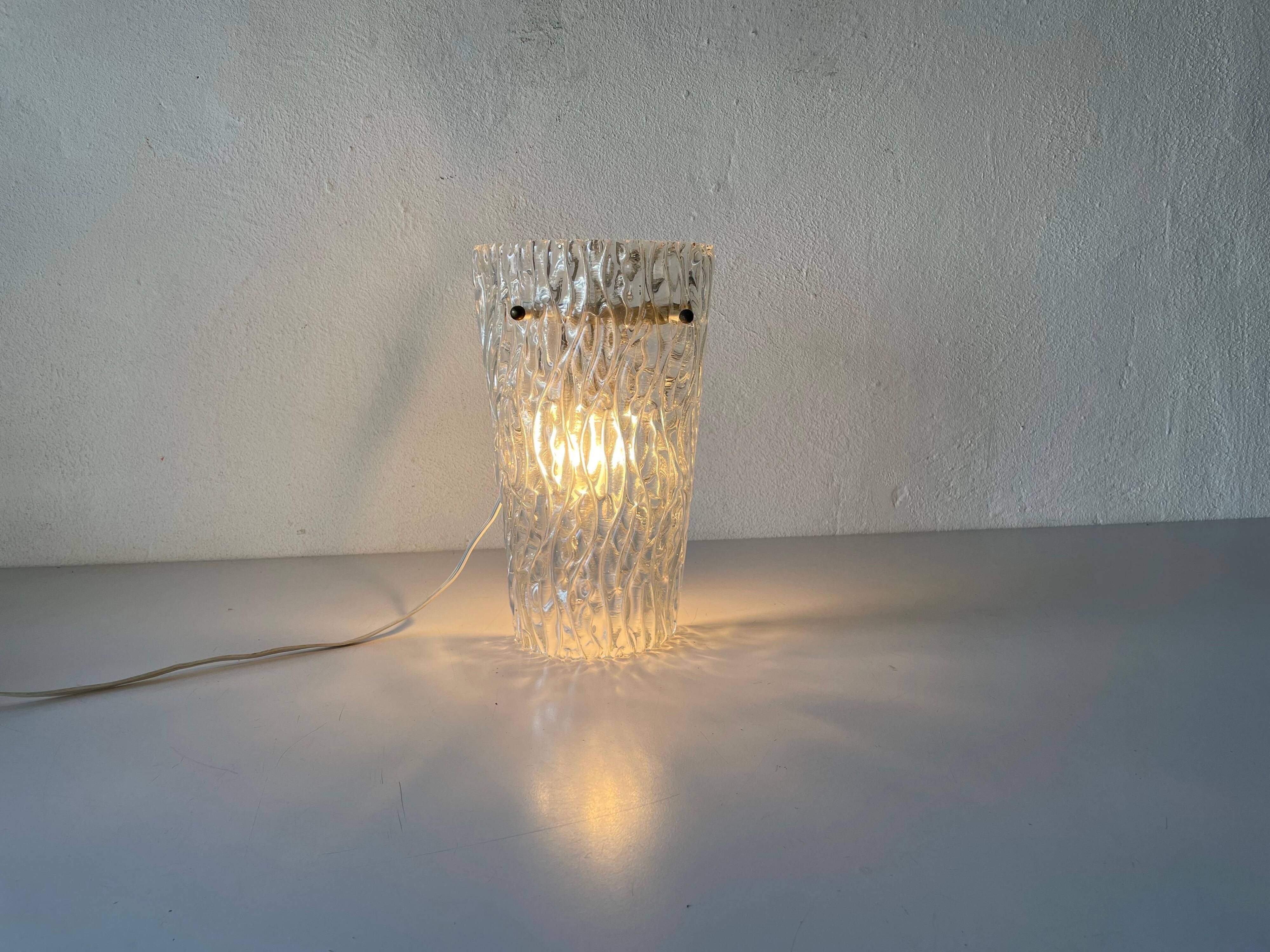Simple arch-shaped wall light in textured glass, 1950s, Germany.