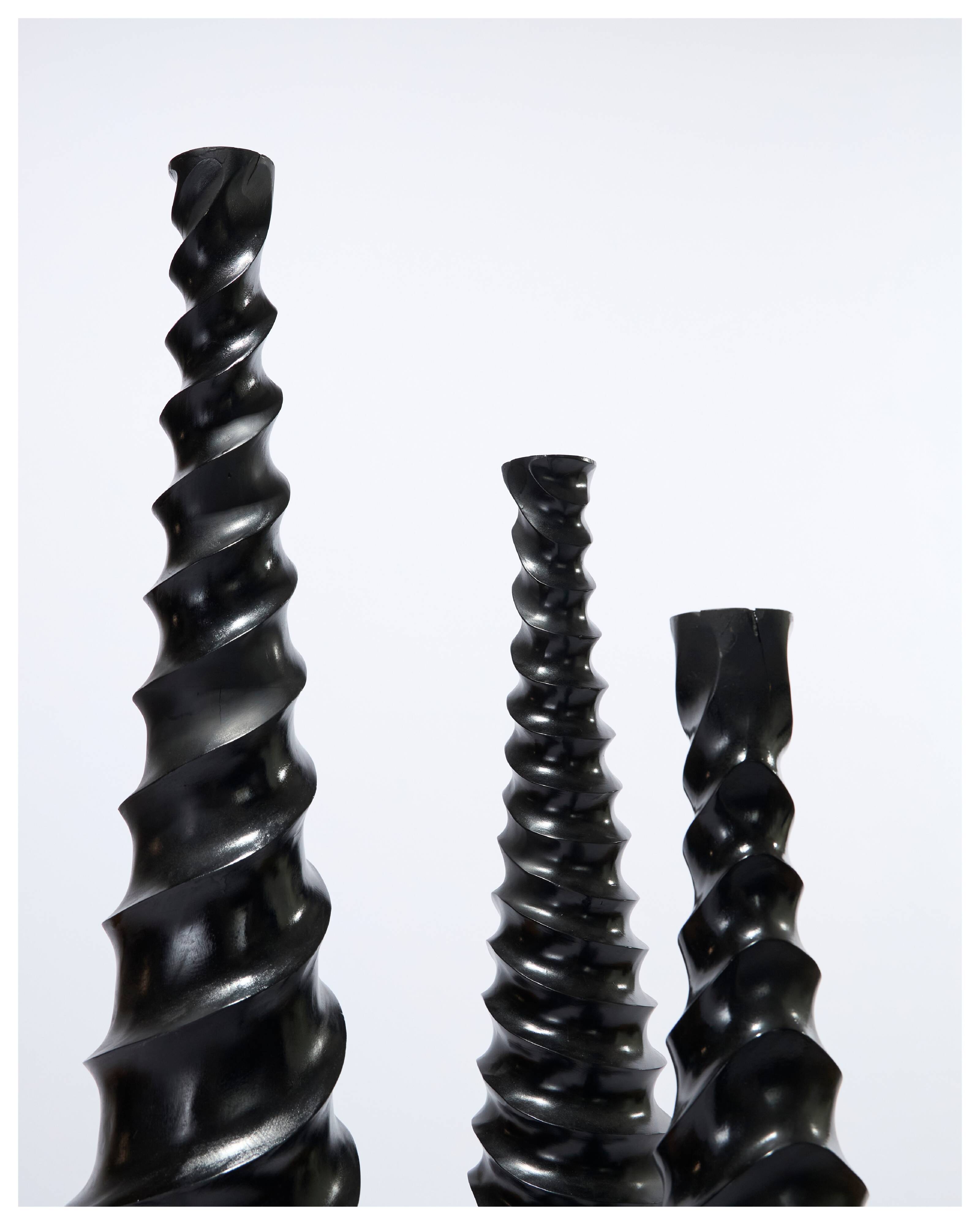 Set of 3 large black vases made of wood and black lacquered.