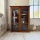 Glass-fronted walnut library 1900