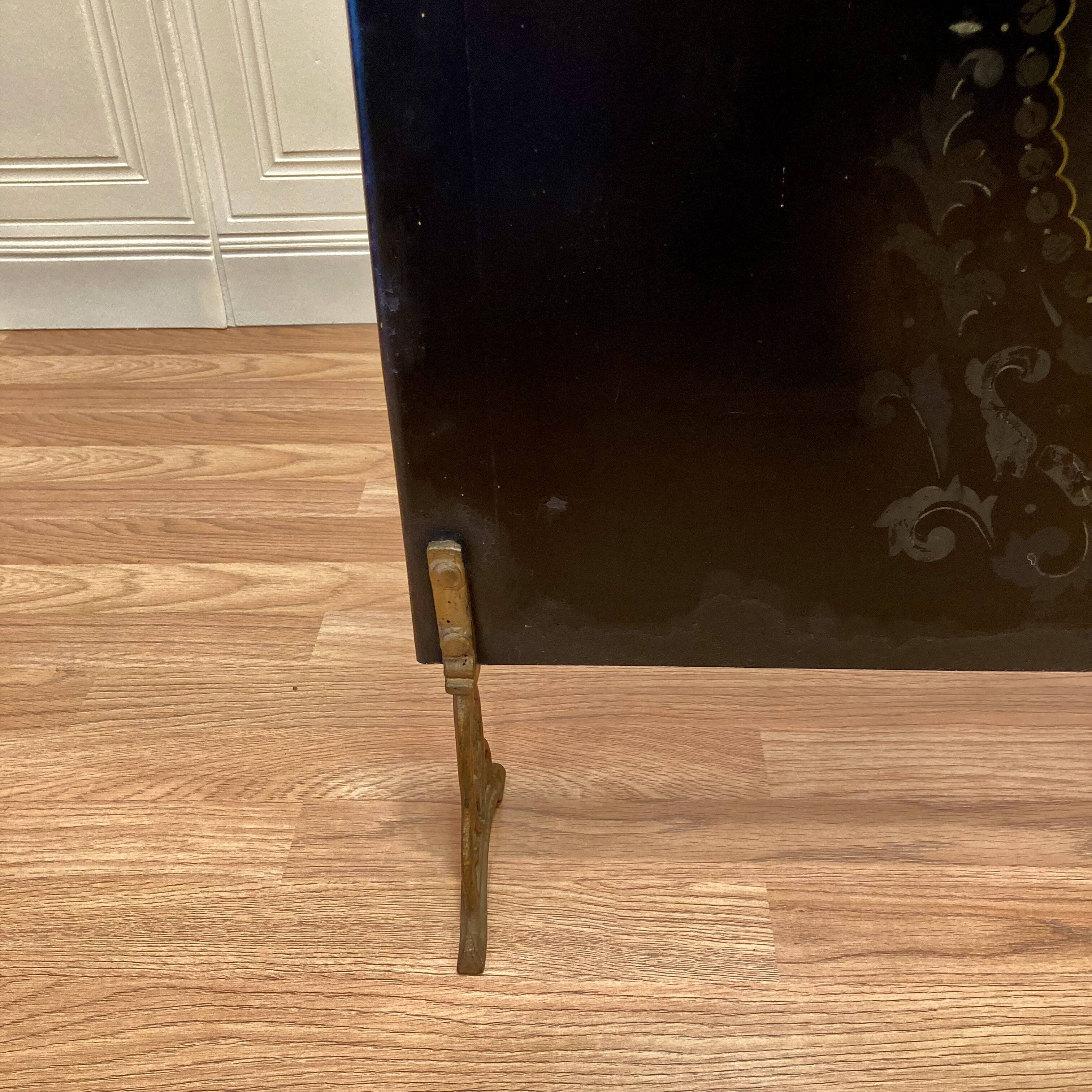 Metal fireplace screen from the period.