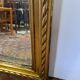 Miroir avec un ange en bois doré et stuc 166x61cm