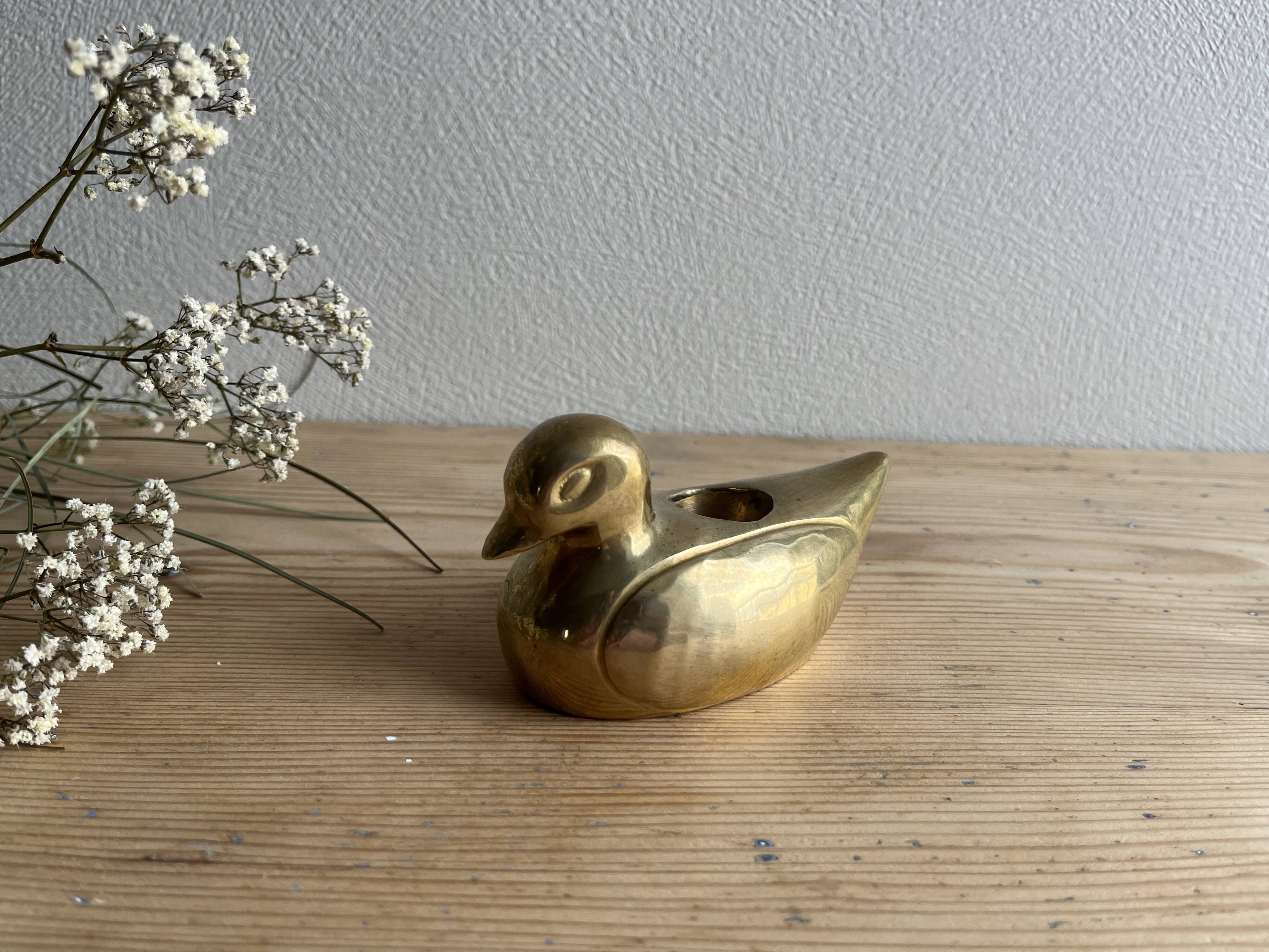 Brass duck candle holder