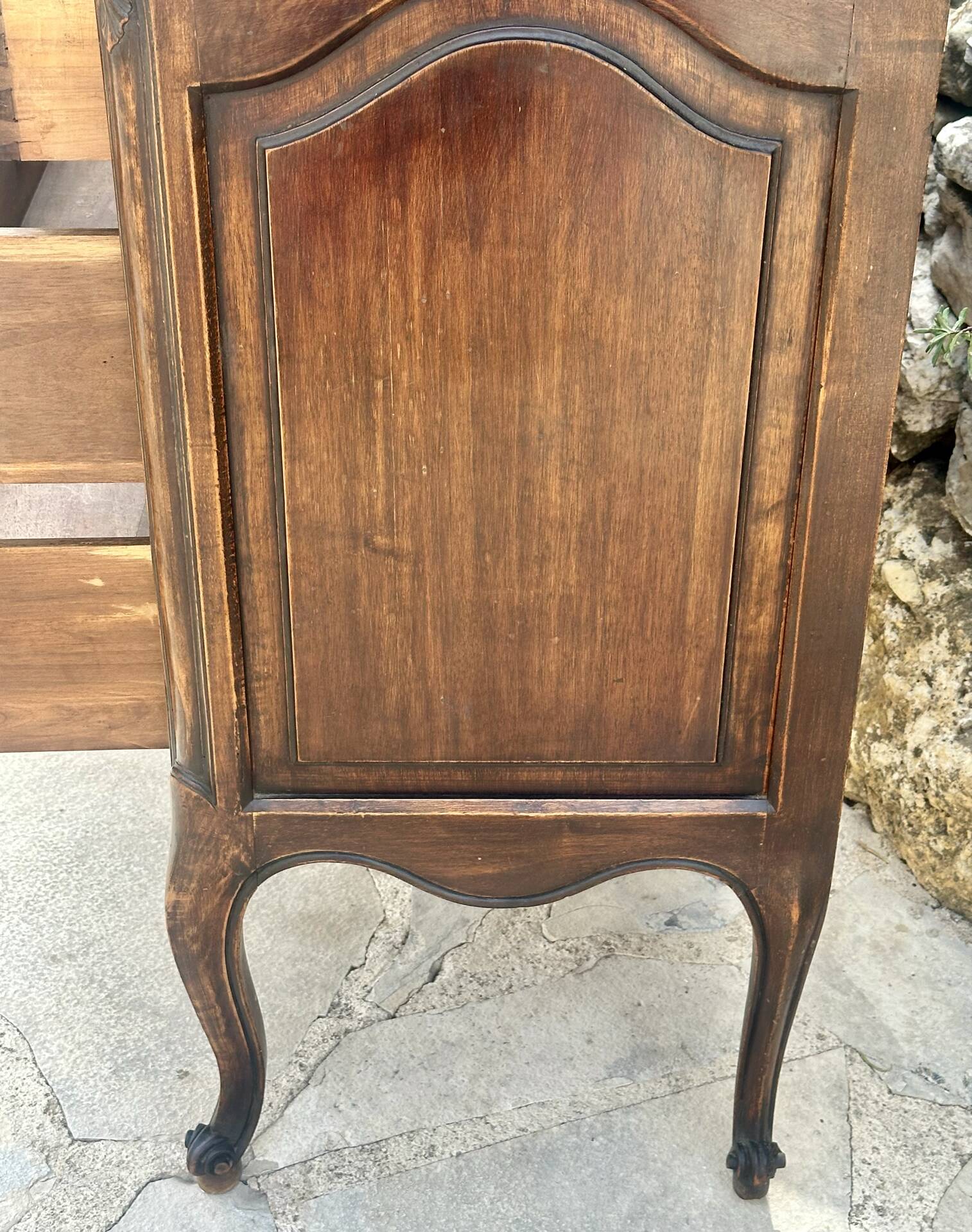 Carved and moulded solid wood commode in the Louis XV style.