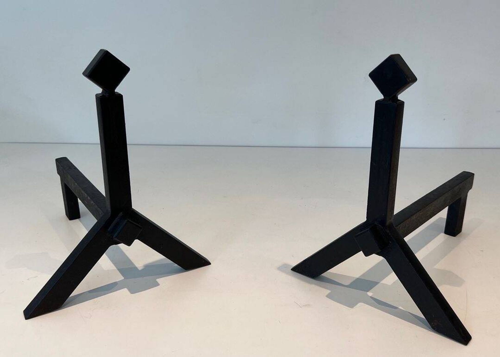 Pair of Modernist Black Iron Andirons with Diamond Finials and Angled Bases