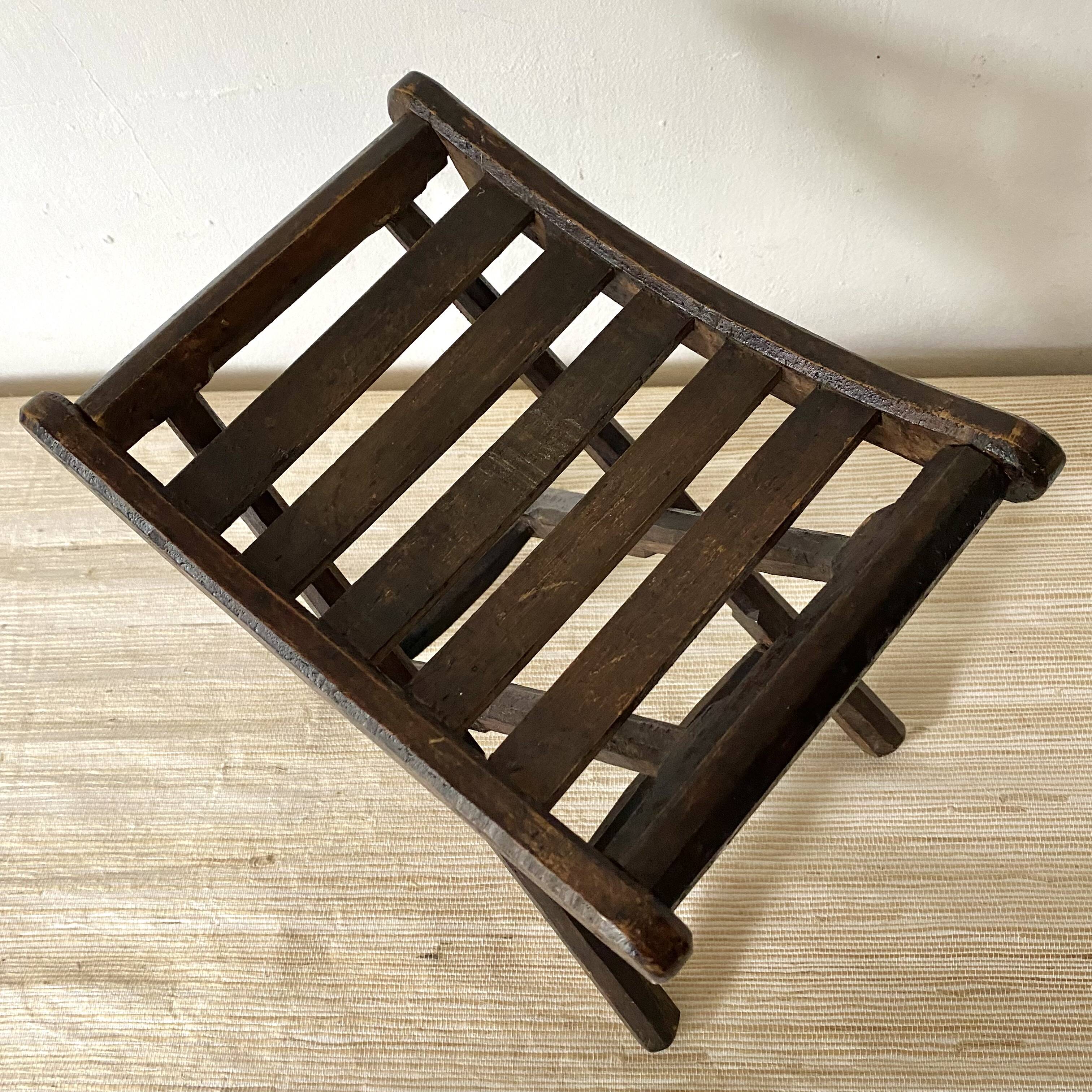 Folding slatted wooden stool