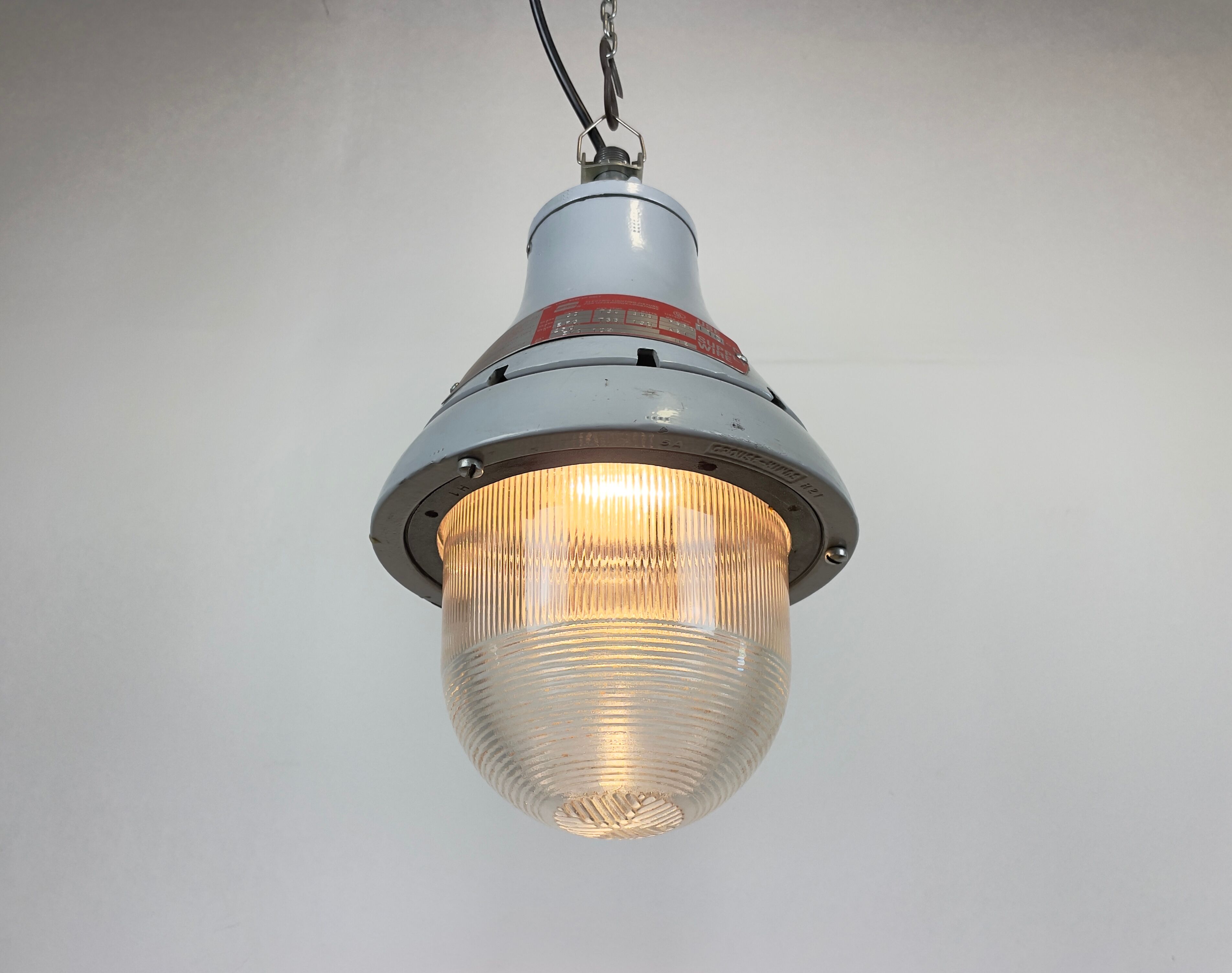 Grey industrial explosion proof light from Crouse-Hinds, 1970s