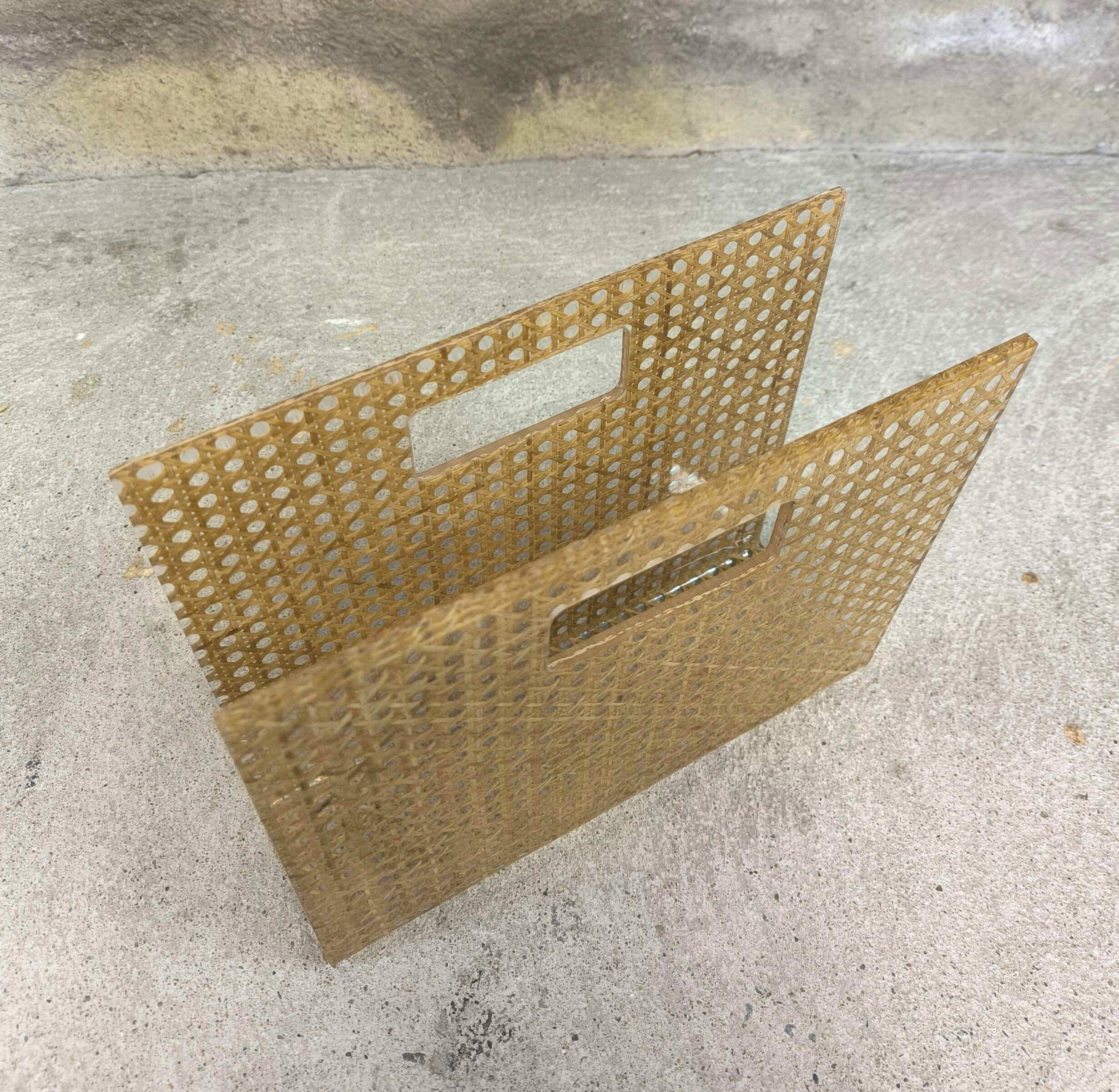 Vintage magazine rack in plexiglass and cane.