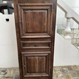 Man - standing - narrow two-door wardrobe with a central drawer