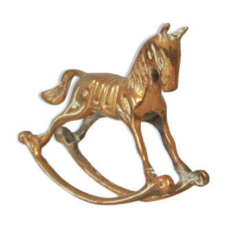 golden bronze figurine rocking horse