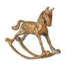 golden bronze figurine rocking horse
