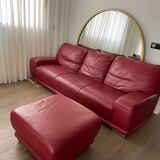 Red leather sofa with ottoman