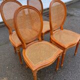 4 caned Louis XVI medallion dining chairs from the 19th century.