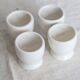 4 vintage Afibel porcelain egg cups - Barbotine decor