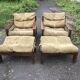 Set of 4 brown leather and wood armchairs with footstools, vintage 1960s style.