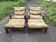 Set of 4 brown leather and wood armchairs with footstools, vintage 1960s style.