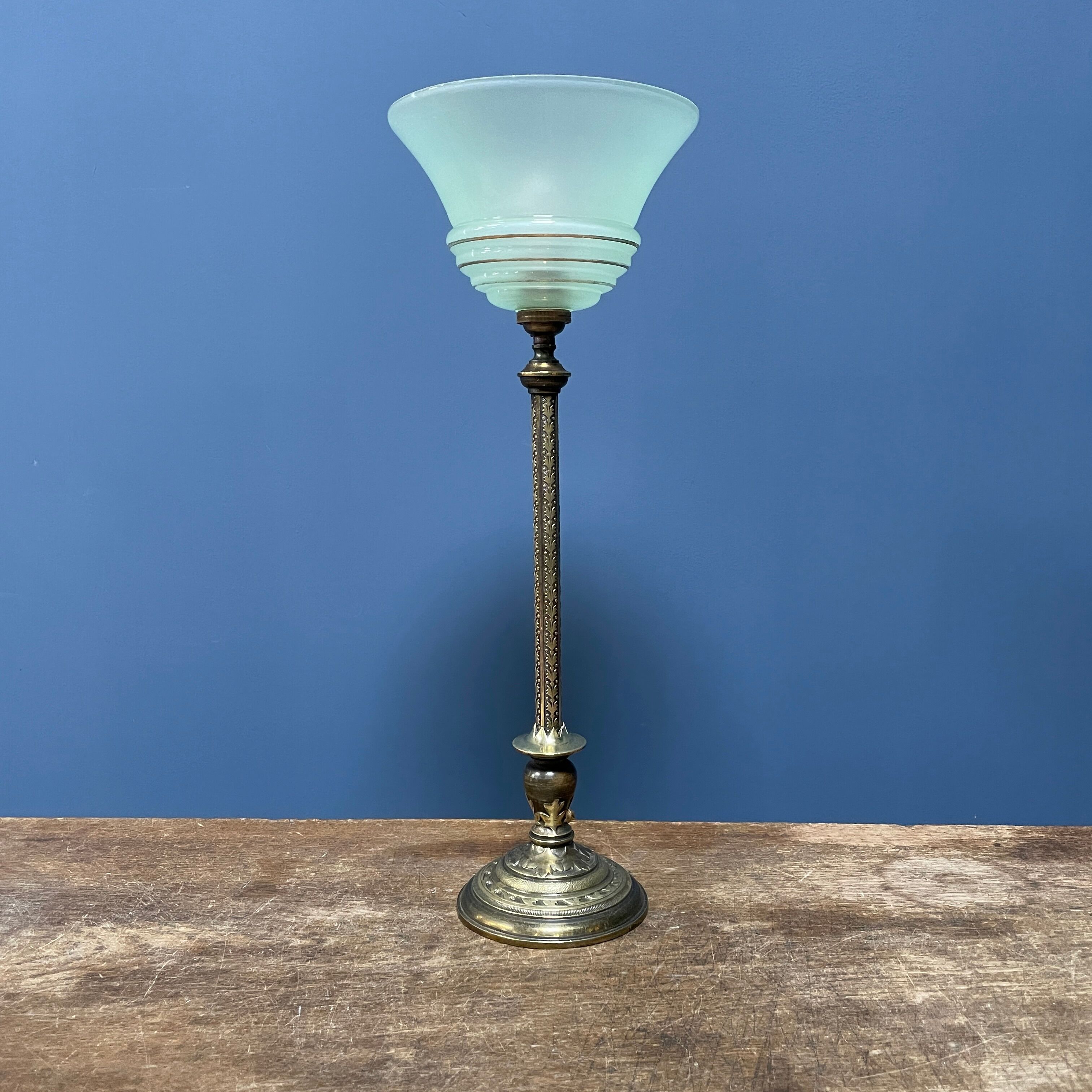 Ornate brass table lamp with mint green glass shade