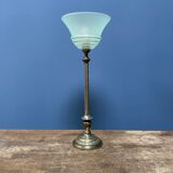 Ornate brass table lamp with mint green glass shade