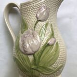 Barbotine pitcher with embossed tulip decoration and spike