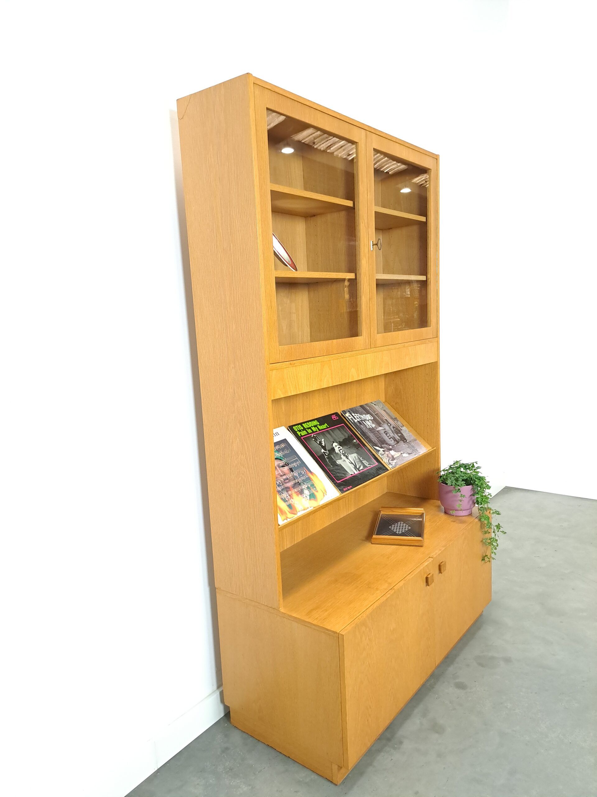 Tall LP display cabinet with glass doors and magazine shelf from Sweden