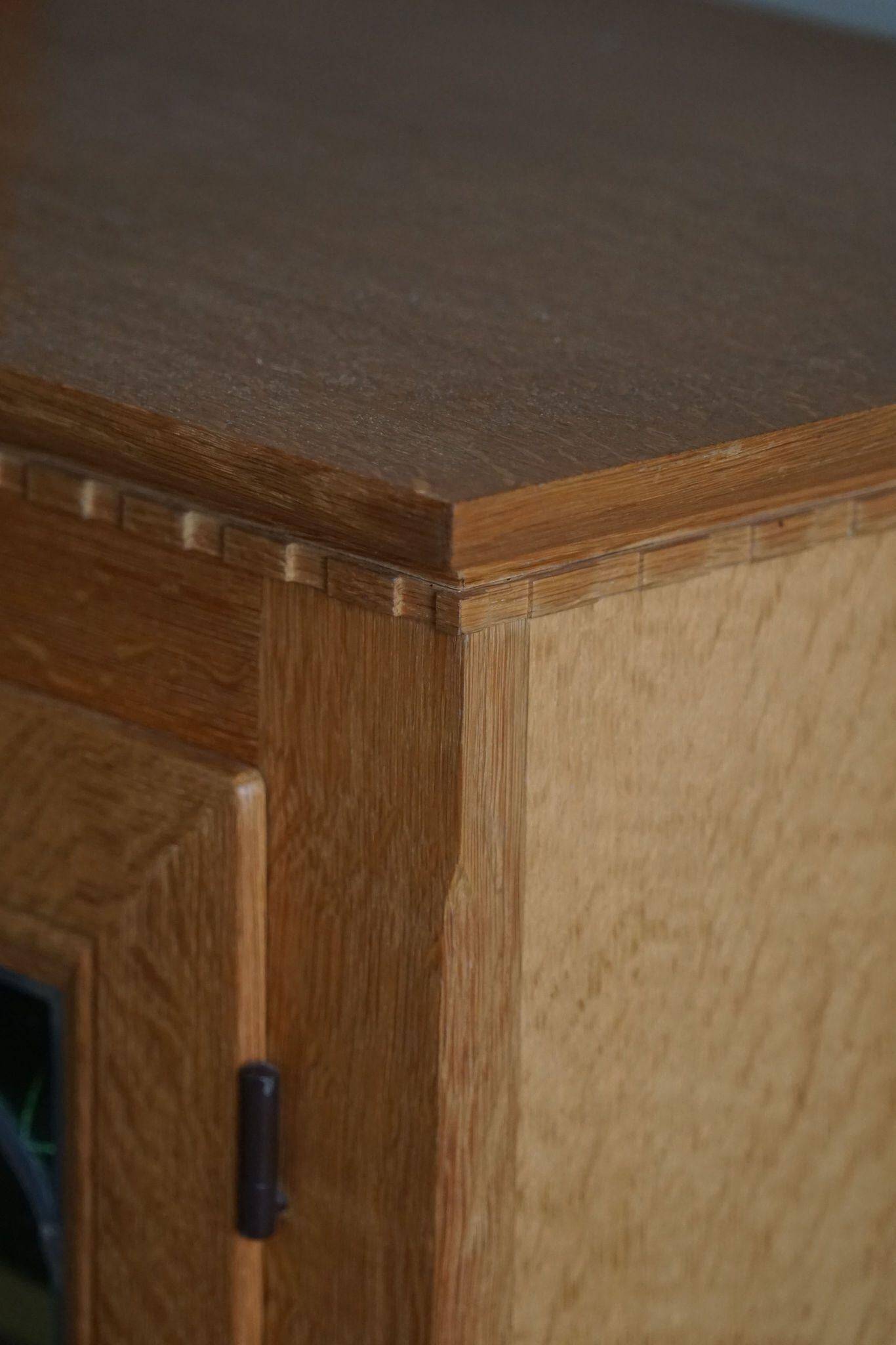 20th-century solid oak display cabinet with a glass front, by a Danish cabinetmaker.