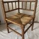 Corner chair in straw and turned wood, fireside chair.